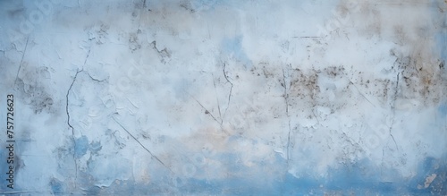 A close up of a winter sky pattern on a concrete wall resembling cumulus clouds in freezing electric blue hues, mimicking a natural meteorological phenomenon