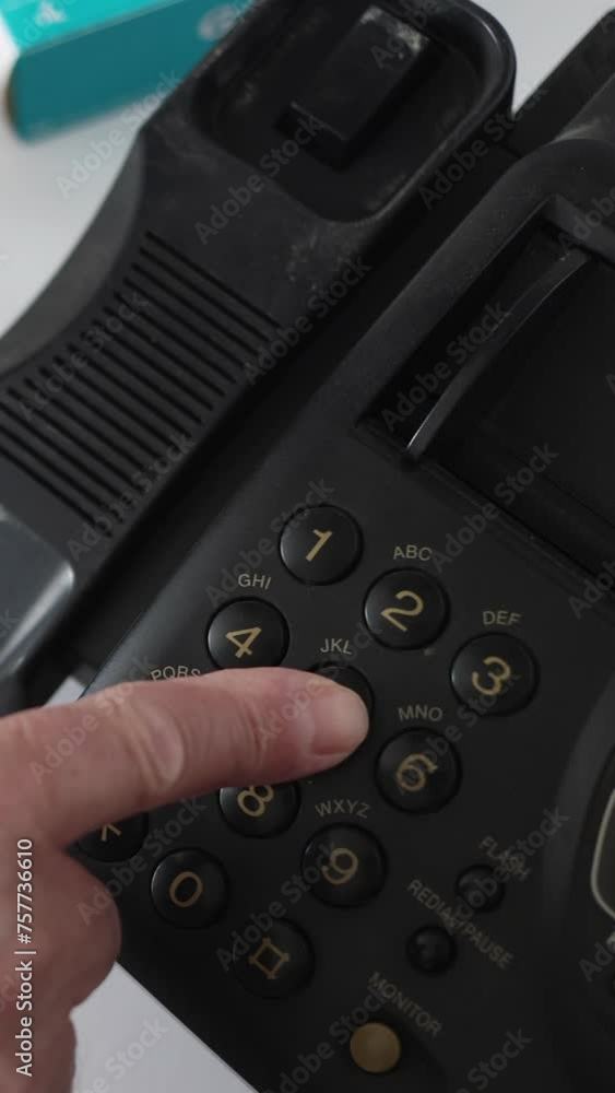 Top View The Doctor Puts The Thermometer On The Table And Picks Up The Phone And Starts Dialing A Phone Number On An Old Black Fax Machine. Vertical