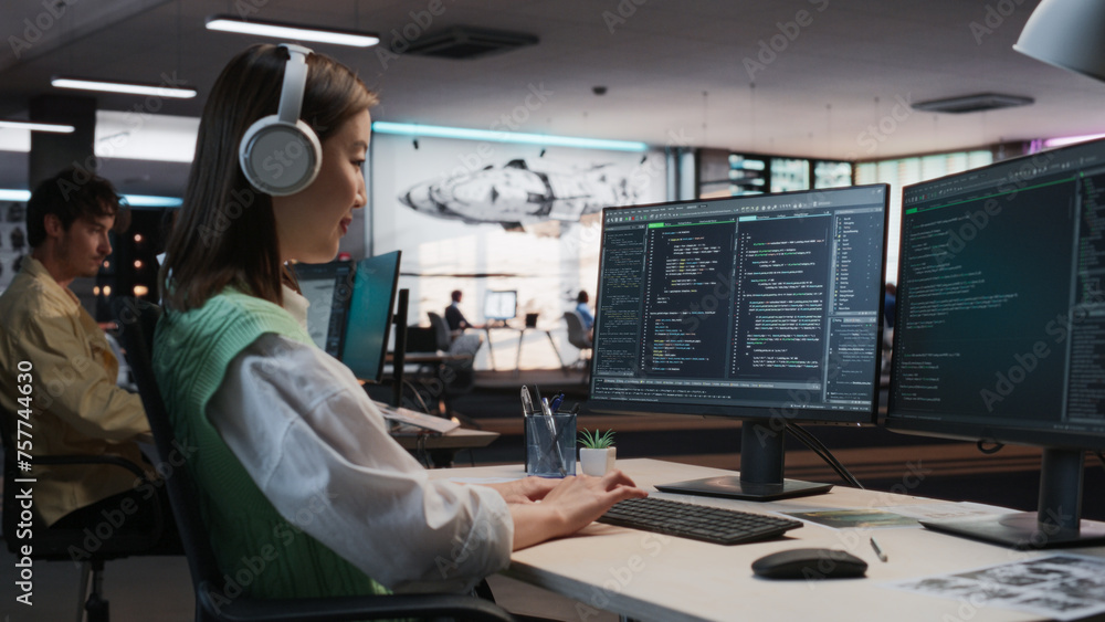 Female Asian Game Programmer Coding On Desktop Computer In Game ...