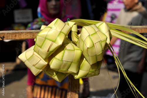 Pile of ketupat made from coconut leaves sold in traditional markets