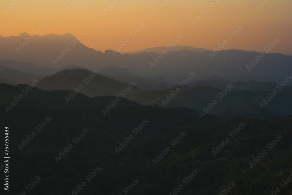 nature traveling with orange sky and layer of mountain with sunrise background nature traveling with orange sky and layer of mountain with sunrise background