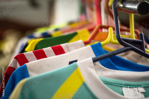 close-up of many soccer jerseys in a store