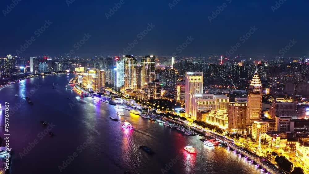 Aerial view of city skyline and modern buildings at night in Shanghai. Drone descent shooting. Aerial view of city skyline and modern buildings at night in Shanghai. Drone descent shooting.