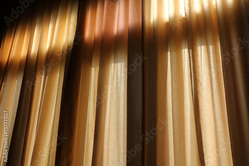 Light through the curtain into the dark room