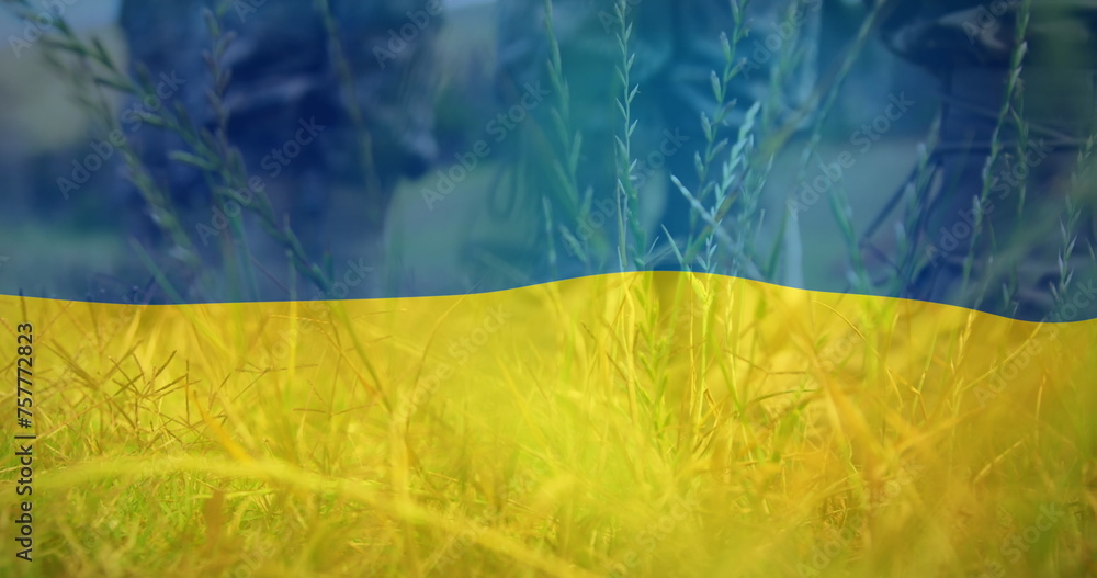 Fototapeta premium Image of flag of ukraine over boots of soldiers