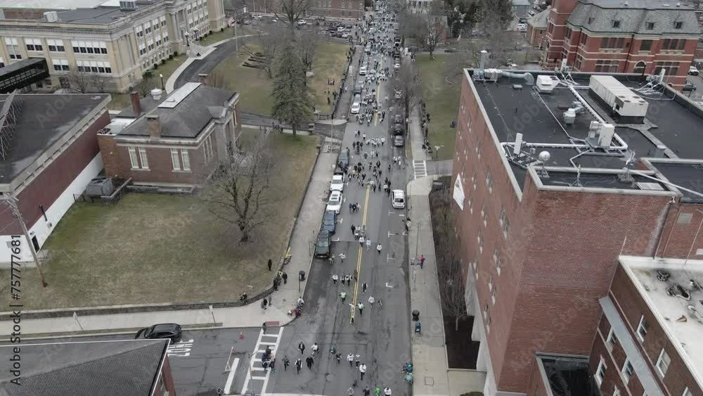 People running and walking on Broadway in Kingston NY for the Shamrock Run People running and walking on Broadway in Kingston NY for the Shamrock Run