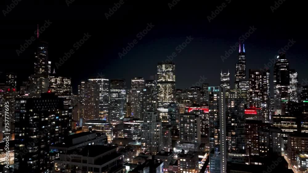 Aerial view backwards over the night lit cityscape of River north, Chicago, USA Aerial view backwards over the night lit cityscape of River north, Chicago, USA