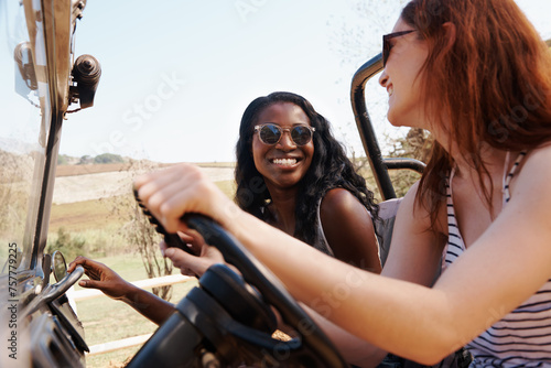 Happy women, bonding and travel on road trip in countryside and sightseeing for adventure in nature. Friends, driving and transportation in offroad vehicle on holiday outdoor in summer in california
