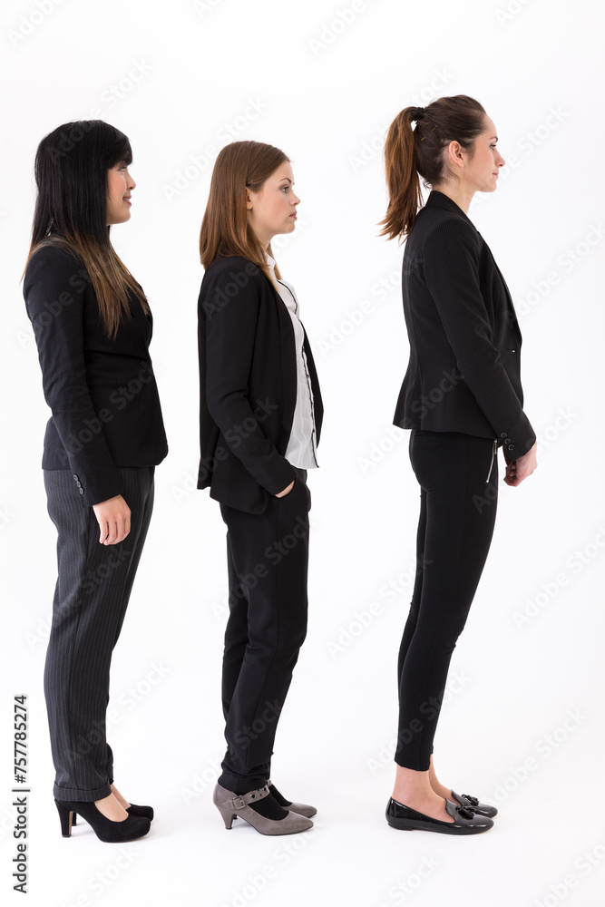 multi-ethnic businesswomen waiting in single line. multi-ethnic businesswomen waiting in single line.