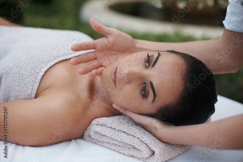 Spa, woman and face with massage for wellness at resort, luxury hotel and vacation for relax and therapeutic pamper. People, masseuse and body care with facial treatment, hospitality and zen outdoor