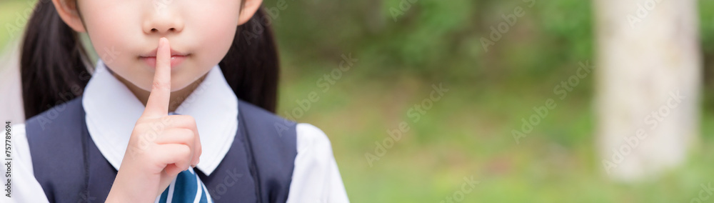 Oriental girl with index finger on her lips. Oriental girl with index finger on her lips.