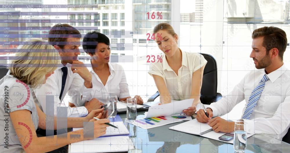 Diverse team discusses business as graphs animate in foreground.