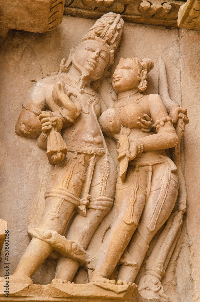 Stone carved sculpture on the outer wall of The Parshwanath temple, Adinath temple, Jain temple, Eastern group of temples, Khajuraho, Madhya Pradesh, India, Asia.