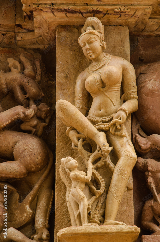 Stone carved sculpture on the outer wall of The Parshwanath temple, Adinath temple, Jain temple, Eastern group of temples, Khajuraho, Madhya Pradesh, India, Asia.