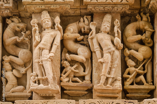 Stone carved sculpture on the outer wall of The Parshwanath temple, Adinath temple, Jain temple, Eastern group of temples, Khajuraho, Madhya Pradesh, India, Asia. photo