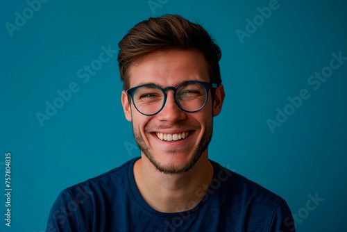 A man with glasses is smiling and looking at the camera © Juan Hernandez