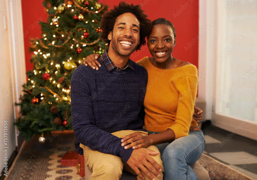 Couple, portrait and Christmas holiday at tree in apartment for bonding celebration with decoration, connection or lights. Man, woman and face in living room for festive season, gifts or marriage