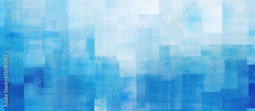 A geometric pattern of rectangles in shades of blue and white, resembling a city skyline with skyscrapers and tower blocks made of glass. A modern art piece