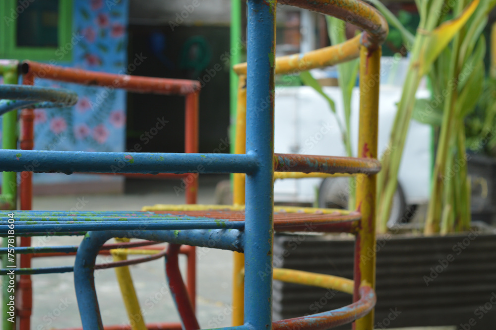 a toy or merry-go-round provided in a park or kindergarten for children to play with. a toy or merry-go-round provided in a park or kindergarten for children to play with.