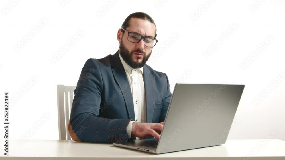A dedicated businessman with glasses is immersed in his work on a laptop in a bright white room, reflecting a professional and clean workspace. Camera 8K RAW. A dedicated businessman with glasses is immersed in his work on a laptop in a bright white room, reflecting a professional and clean workspace. Camera 8K RAW.