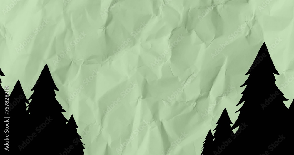 Naklejka premium Image of pine tree silhouettes over moving scrunched paper background