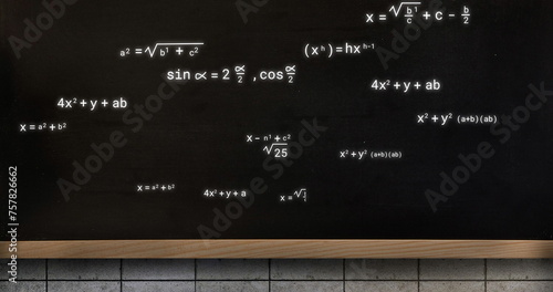 Image of mathematical equations over black board