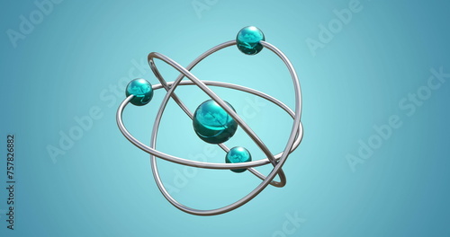 Image of atom model spinning on blue background