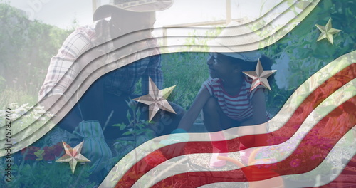 Image of flag of usa waving over african american father and daughter gardening plants