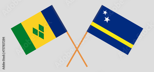 Crossed flags of Saint Vincent and the Grenadines and Country of Curacao. Official colors. Correct proportion