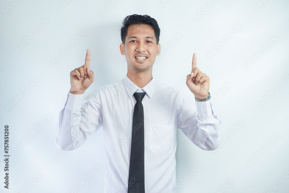 Adult Asian man smiling happy with both hands pointing up Adult Asian man smiling happy with both hands pointing up
