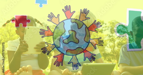 Image of colourful puzzle pieces and globe with hands over children sing tablets