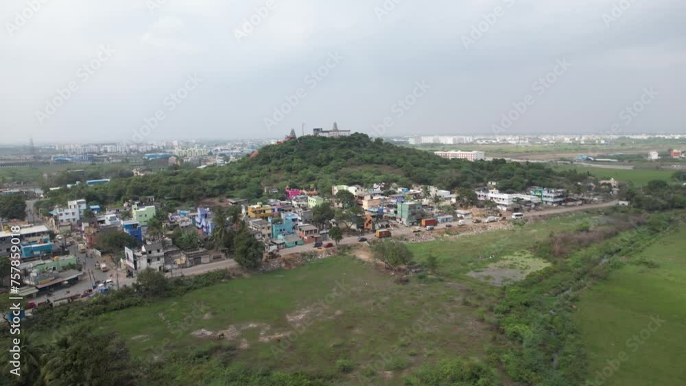 Aerial Shot of Hill in Indian City Surrounded by Houses Aerial Shot of Hill in Indian City Surrounded by Houses