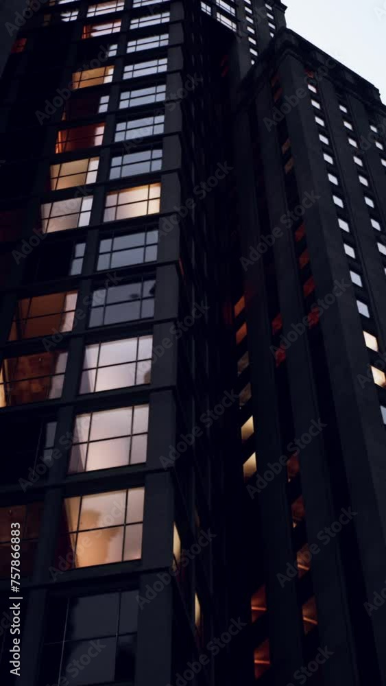 A very tall building with lots of windows A very tall building with lots of windows