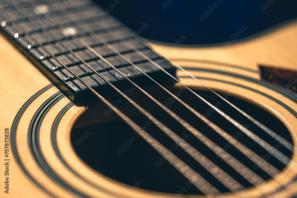 Fototapeta premium Close up of guitar and strings with shallow depth of field, soft focus.
