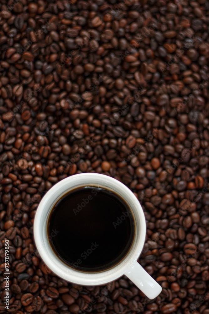 A cup of coffee with coffee beans. A cup of coffee with coffee beans.