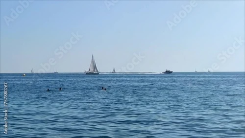 Floating boat and yacht on the horizon of the blue Mediterranean sea
