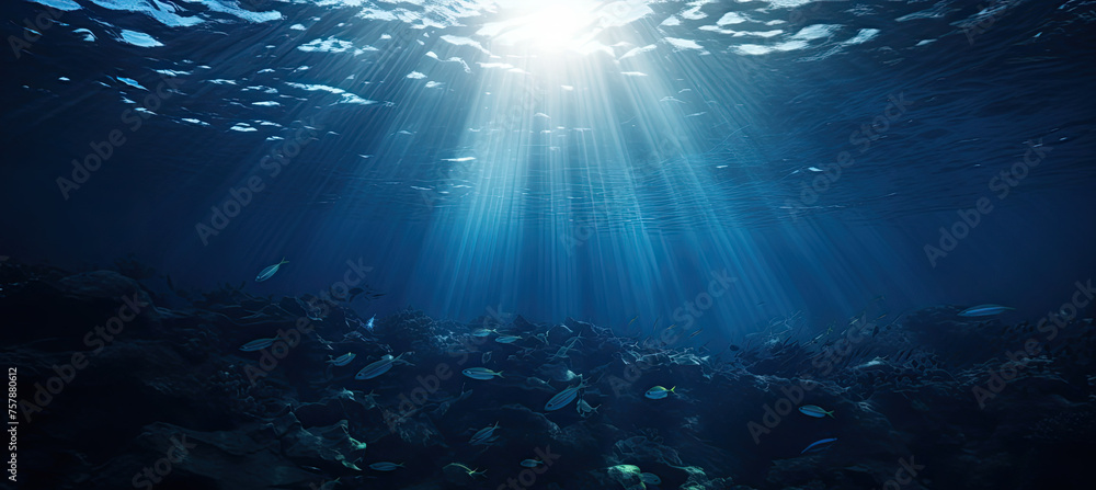 Fototapeta premium Dark blue ocean surface seen from underwater. sun light rays under water