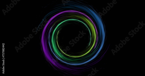 Image of colourful light trails forming circles on black background