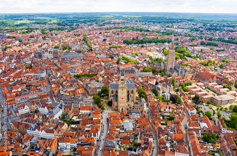 Bruges, Belgium. City center. Residential areas. Panorama of the city. Summer day, cloudy weather. Aerial view