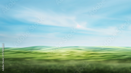 Abstract  blurred green landscape with blue sky backdrop 