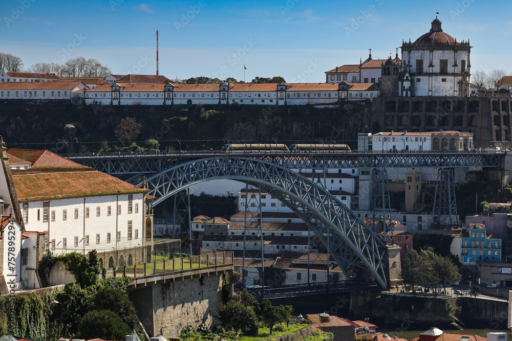 Porto from above. Landscape photo with the landmarks and cityscape of Porto and Luis Bridge during a sunny spring day in Portugal. 