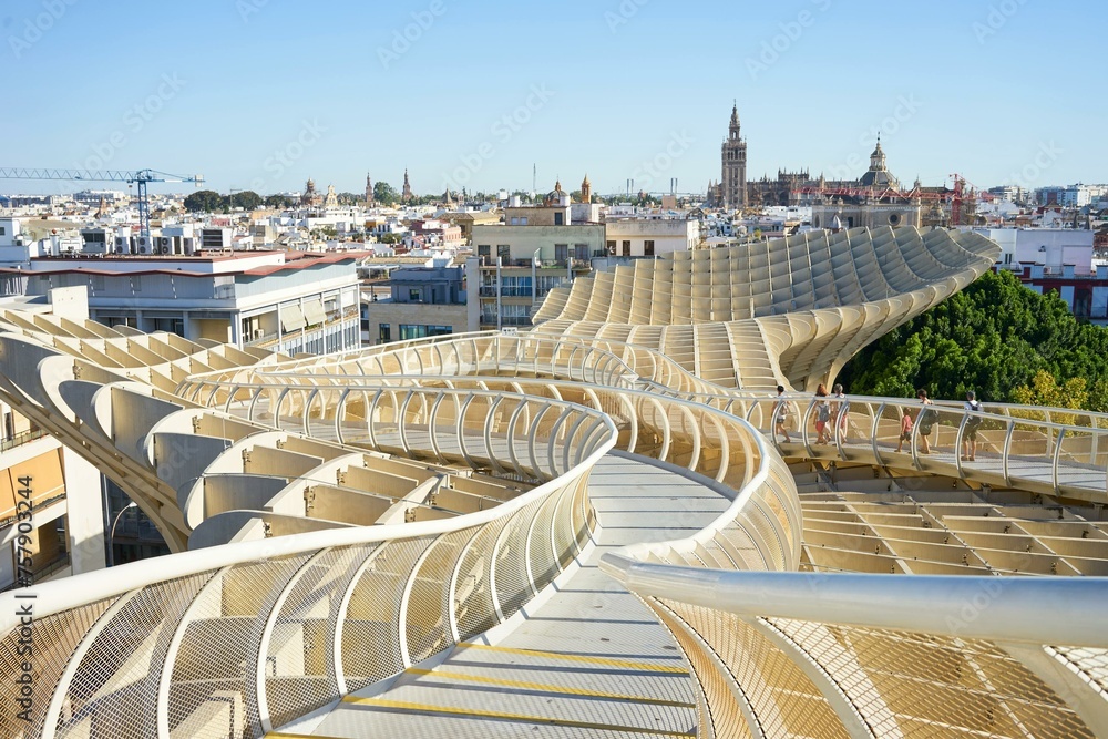 Fototapeta premium Seville cityscape as seen from metropol parasol building.people walking around and enjoying the view.