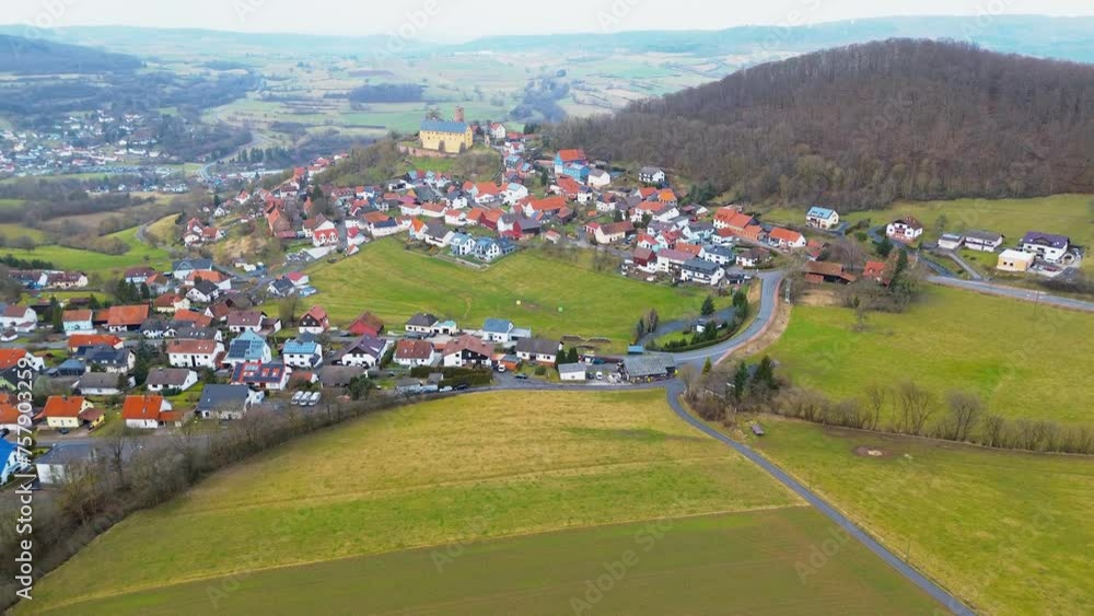 Serene Aerial View of a Small Town with Castle in the Countryside Serene Aerial View of a Small Town with Castle in the Countryside