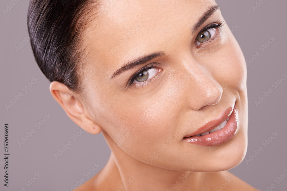 Obraz premium Cosmetics, studio and portrait of woman with beauty, wellness and gloss for makeup and treatment. Dermatology, salon and face of person with lipstick, foundation and facial care on grey background