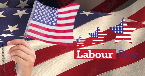 Image of labor day text with american flag stars and hand holding flag, over american flag