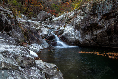 View of the cascade waterfall in the autumn mountain photo