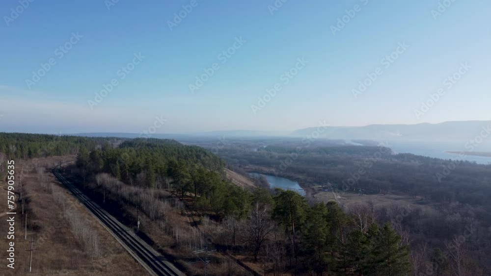 Railway in the forest autumn view from a drone. Empty Railway. Concept of nature forest preservation and reforestation. Harmony Calm Relaxation. Save Earth Green Planet. Railway in the forest autumn view from a drone. Empty Railway. Concept of nature forest preservation and reforestation. Harmony Calm Relaxation. Save Earth Green Planet.