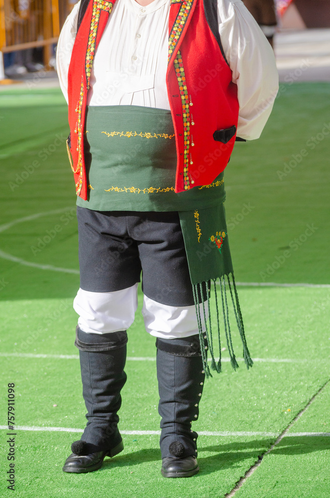 Obraz premium partial view of man at a music event in traditional Galician costume