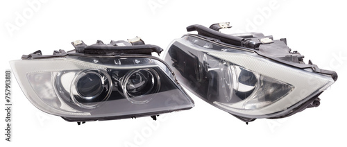 Stylish xenon headlight of a German car - optical equipment with a lamp inside on a white isolated background. Spare part for auto repair in a car workshop.