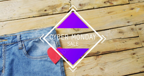 Image of cyber monda sale text over denim trousers on wooden background
